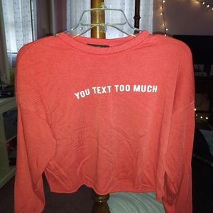 "You text too much" red cropped sweatshirt